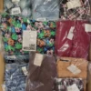 The photo shows a package with clothing in the category AW.