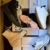 The photo shows a package with footwear in the category BS.