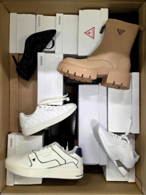 The photo shows a package with footwear in the category BS.