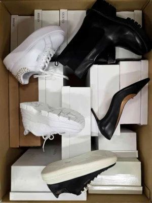 The photo shows a package with footwear in the category BS.