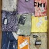 The photo shows a package with clothing in the category AR.