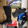 The photo shows a package with footwear in the category CS.