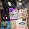 The photo shows a package with clothing in the category AW.