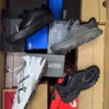 The photo shows a package with footwear in the category CS.