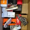 The photo shows a package with footwear in the category CS.