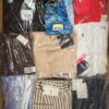 The photo shows a package with clothing in the category AW.