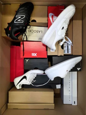 The photo shows a package with footwear in the category CS.