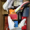 The photo shows a package with footwear in the category CS.