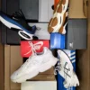The photo shows a package with footwear in the category CS.