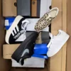 The photo shows a package with footwear in the category CS.