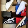 The photo shows a package with footwear in the category CS.