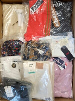 The photo shows a package with clothing in the category AW.