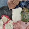 The photo shows a package with clothing in the category SN.