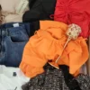 The photo shows a package with clothing in the category SN.