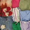 The photo shows a package with clothing in the category SN.
