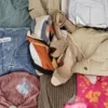 The photo shows a package with clothing in the category SN.