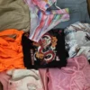The photo shows a package with clothing in the category SN.