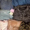 The photo shows a package with clothing in the category SN.