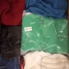 The photo shows a package with clothing in the category SN.