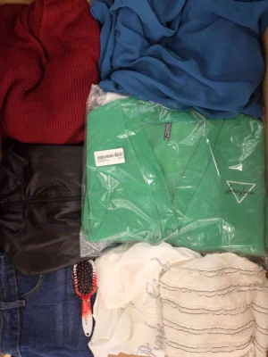 The photo shows a package with clothing in the category SN.