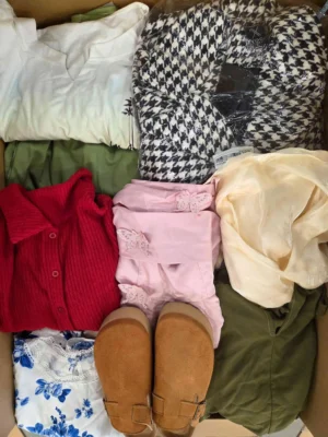 The photo shows a package with clothing in the category SN.