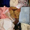 The photo shows a package with clothing in the category SN.
