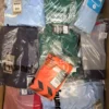 The photo shows a package with clothing in the category H.