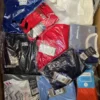The photo shows a package with clothing in the category H.