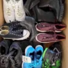 The photo shows a package with footwear in the category SH.