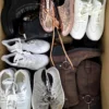 The photo shows a package with footwear in the category SH.