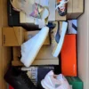 The photo shows a package with footwear in the category AS.