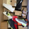 The photo shows a package with footwear in the category AS.