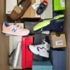 The photo shows a package with footwear in the category AS.