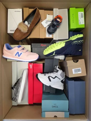 The photo shows a package with footwear in the category AS.