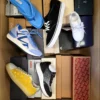 The photo shows a package with footwear in the category AS.