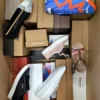 The photo shows a package with footwear in the category AS.