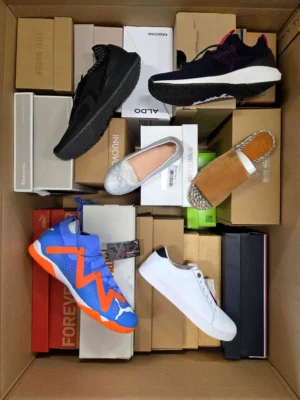 The photo shows a package with footwear in the category AS.