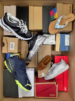 The photo shows a package with footwear in the category AS.