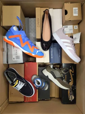 The photo shows a package with footwear in the category AS.