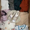 The photo shows a package with clothing in the category BSN.