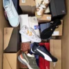 The photo shows a package with footwear in the category AS.