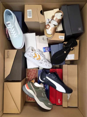 The photo shows a package with footwear in the category AS.