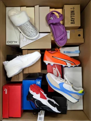 The photo shows a package with footwear in the category AS.