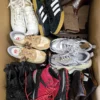 The photo shows a package with footwear in the category SH.