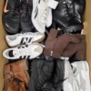 The photo shows a package with footwear in the category SH.