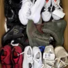The photo shows a package with footwear in the category SH.