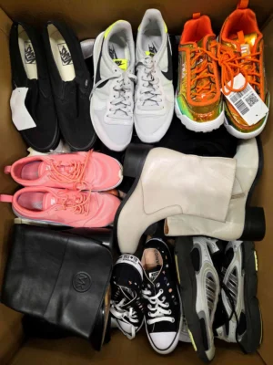 The photo shows a package with footwear in the category SH.