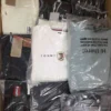 The photo shows a package with clothing in the category T.