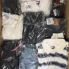 The photo shows a package with clothing in the category T.