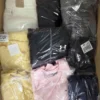 The photo shows a package with clothing in the category T.